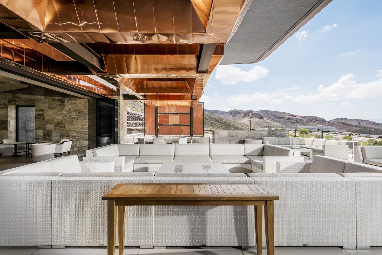 Ascaya Club House Members Exterior Sitting with Big White outdoor sitting area