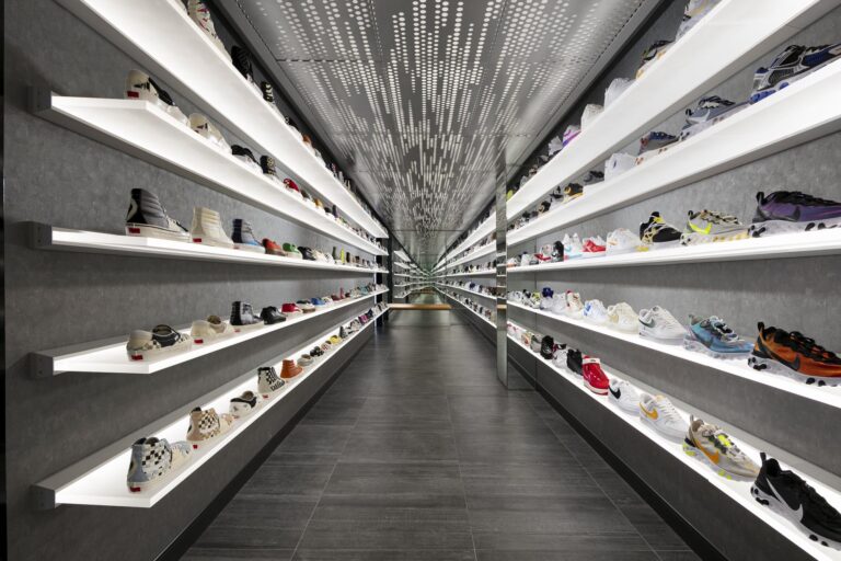 Shoe Tunnel features white shelves and metal design elements at the Features limited edition store.