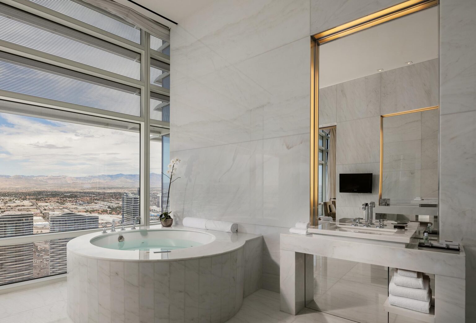 Aria Sky Suite Master Bathroom with a big spa tub and las vegas mountain views